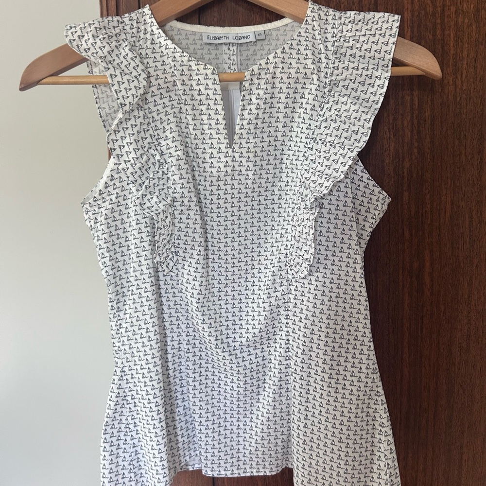White and Black Ruffled Sleeveless Blouse